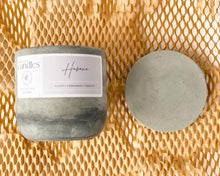 Load image into Gallery viewer, tabacco scented soy wax candle in cement vessel with lid