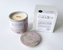 Load image into Gallery viewer, lavender scented soy wax candle in decorative cement vessel
