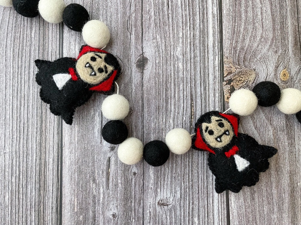 Dracula Halloween Garland. Halloween Decor made with black and white  felt pom poms and felted Draculas.